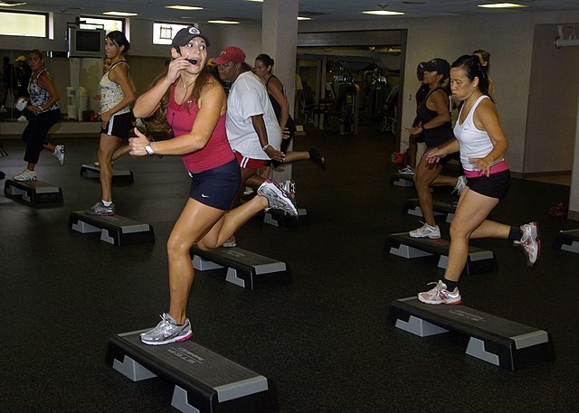 Elizabeth Griffin, step-aerobics instructor, motivates her class to keep up the pace during the Aerobathon at Towle Court Fitness Center Sept. 19. The Aerobathon ran from 9 a.m. to noon offering spin classes, Zumba and kickboxing.